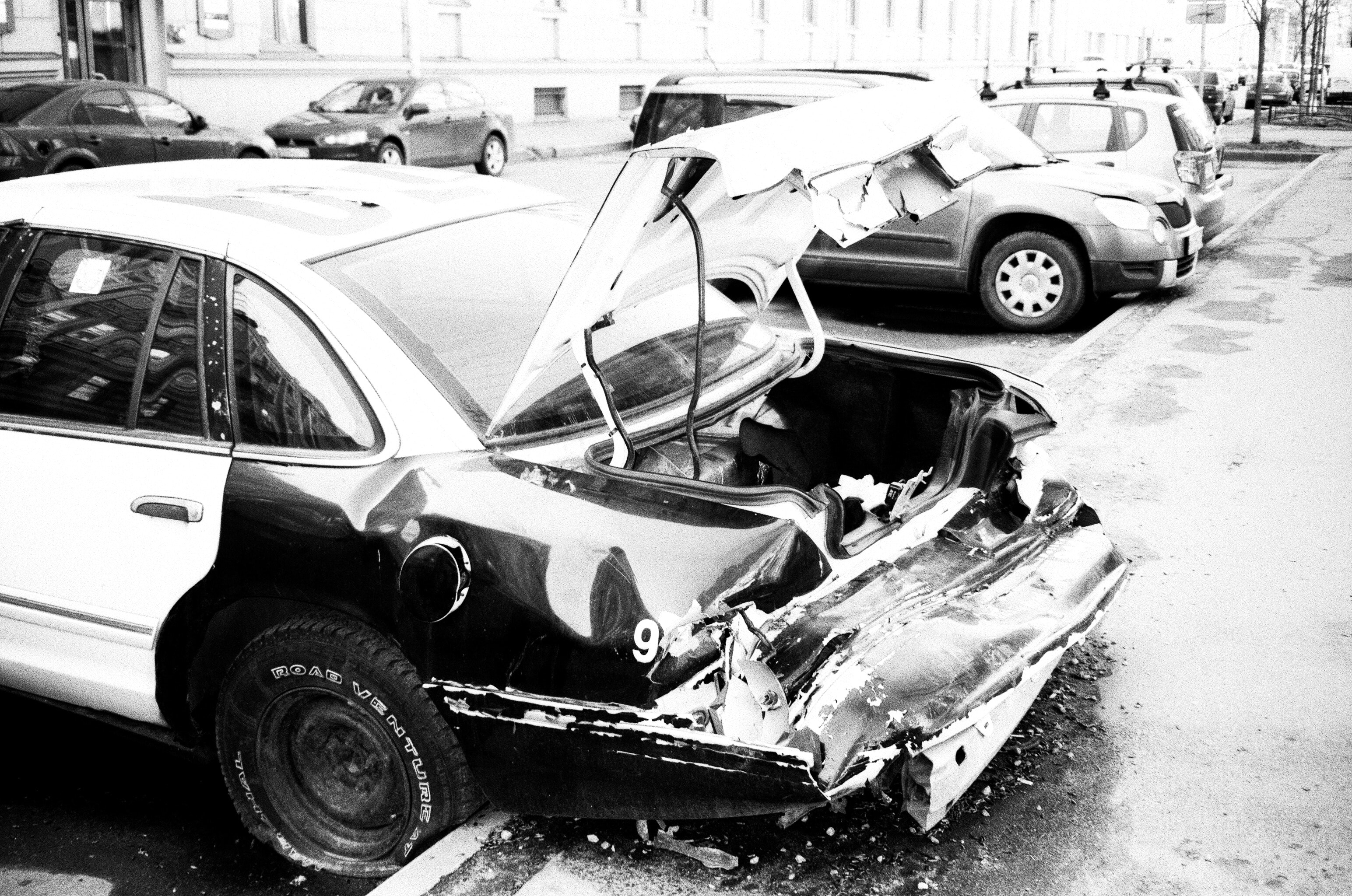 black and white wrecked car