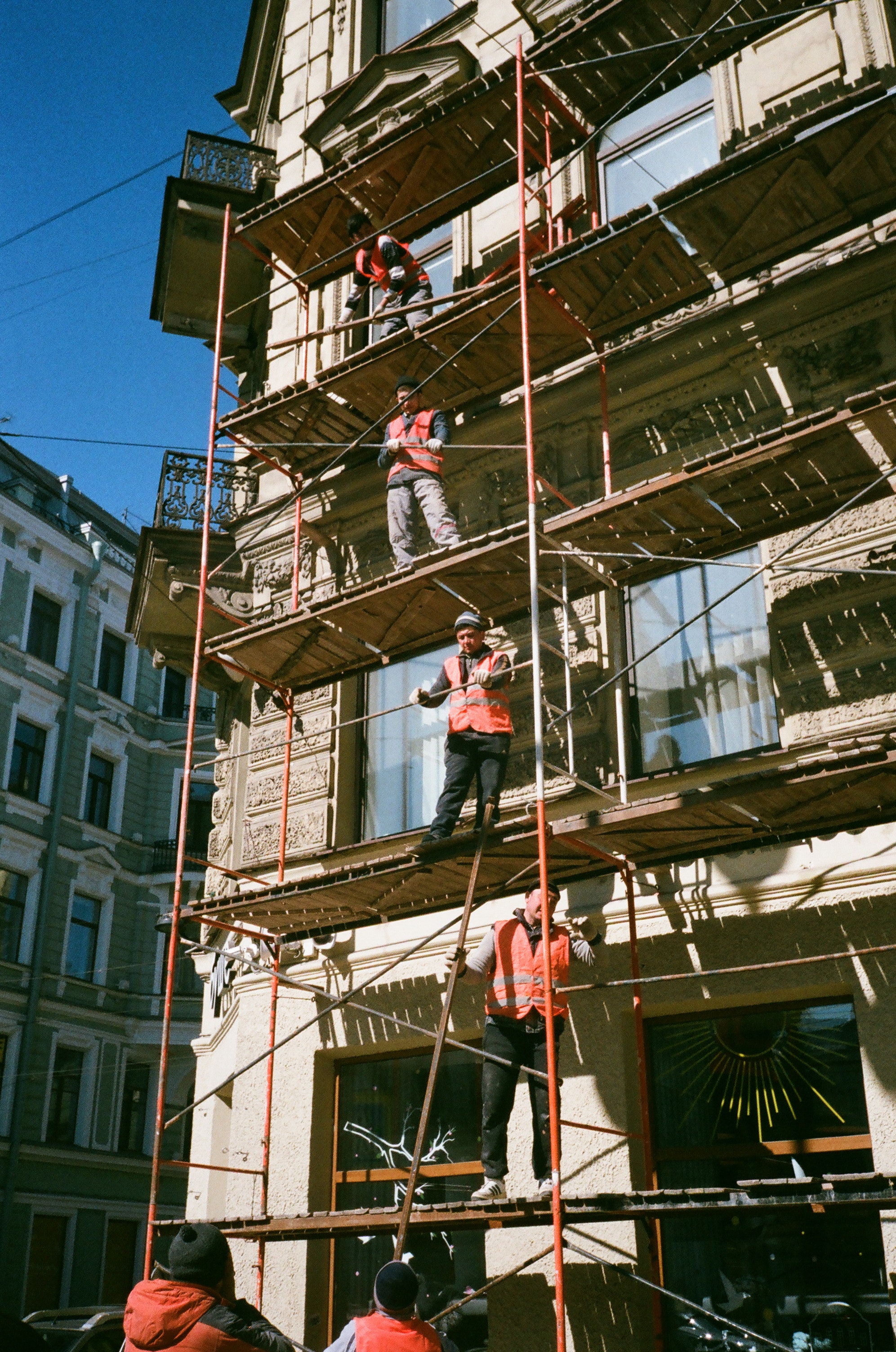 construction workers on scaffolding