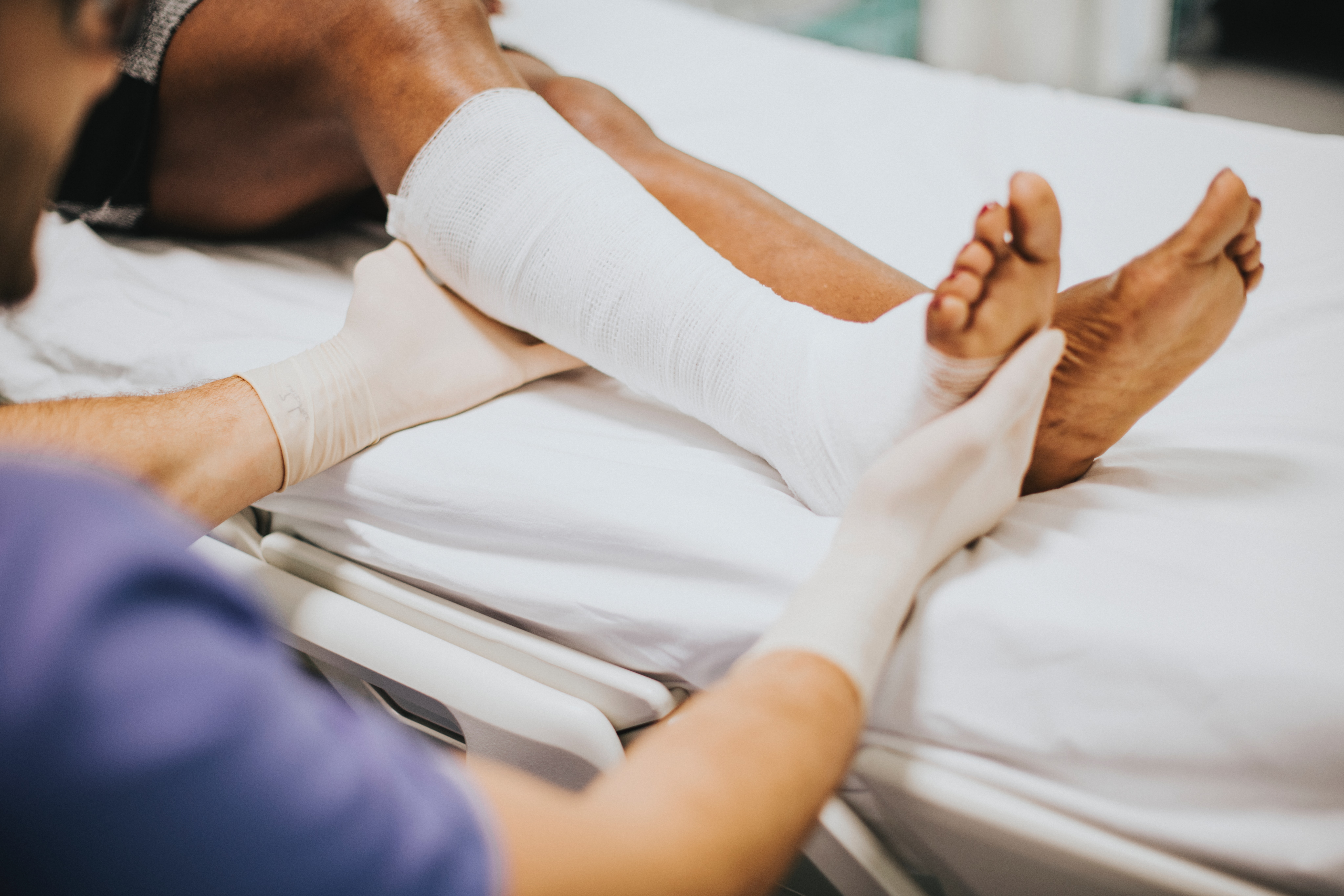 slip trip and falls wrapped ankle medics hands
